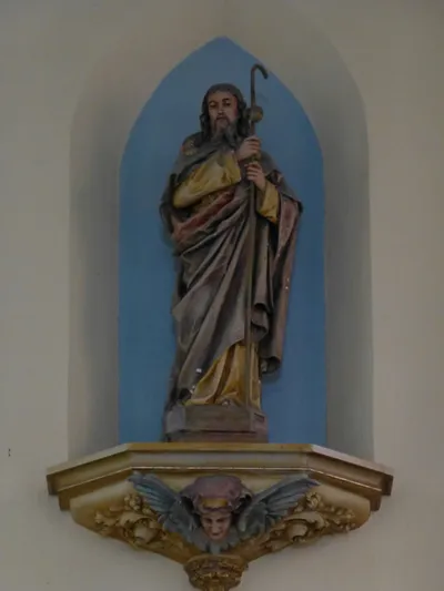 Statue of St. James atop sanctuary wall.
