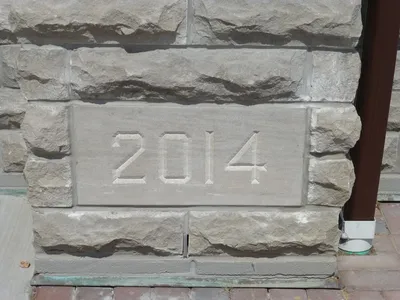 Cornerstone for recent additions to the church.