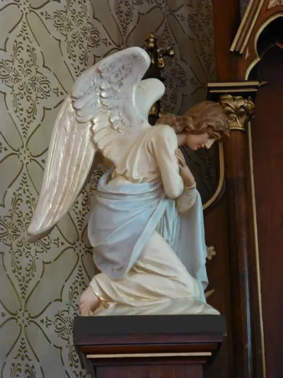 Angel statue on high altar.