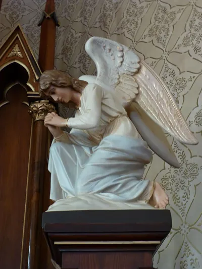 Angel statue on high altar.
