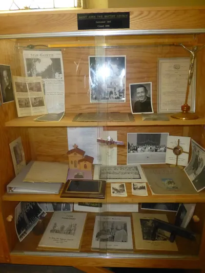 Display cabinet at Ss. Peter and Paul with historical items from St. Cecilia.