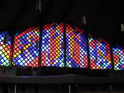 Stained glass window along the back of the church.