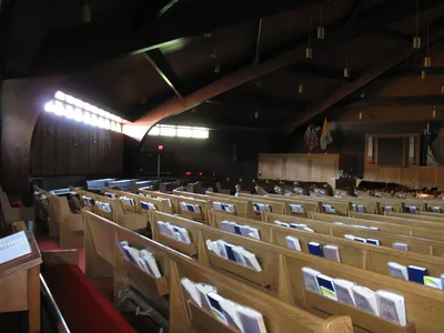 Left side of the church.