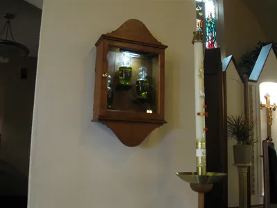 Ambry and paschal candle.