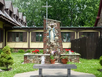 Our Lady Queen of Peace shrine behind the church.