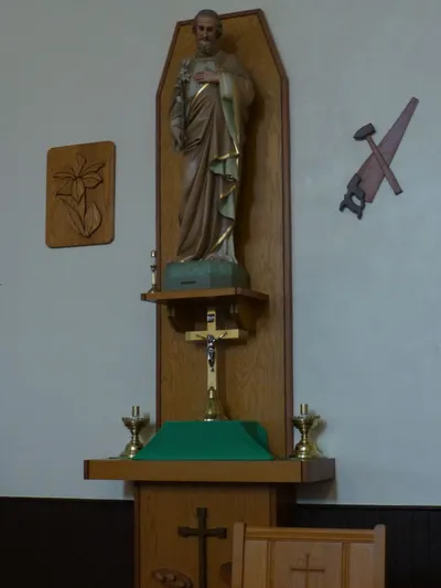 Statue of St. Joseph, reliefs, tabernacle.