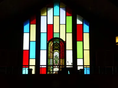 Stained glass. Small window might be from former church.