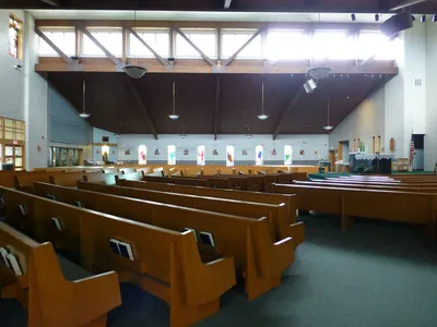 Left side of the church.