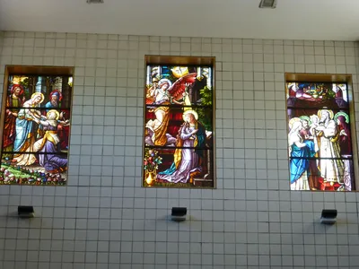 Stained glass windows above the main entrance, from the former St. Patrick Cathedral in downtown Rochester.