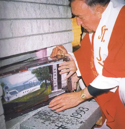 Placing time capsule inside of the corner stone.