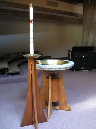 Baptismal font and paschal candle.