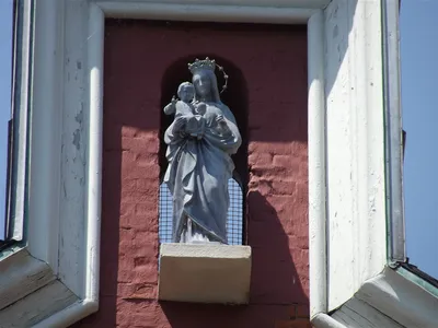 Statue of St. Mary atop church.