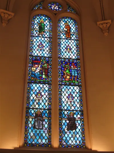 Stained glass windows memorial plaque.