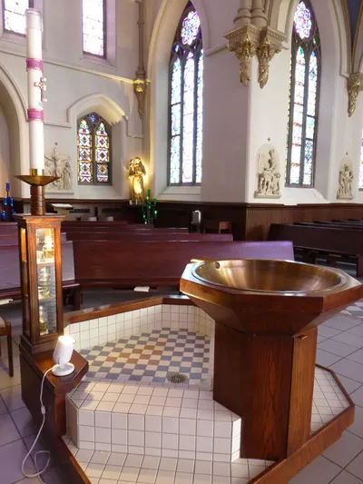 Baptismal font and paschal candle.