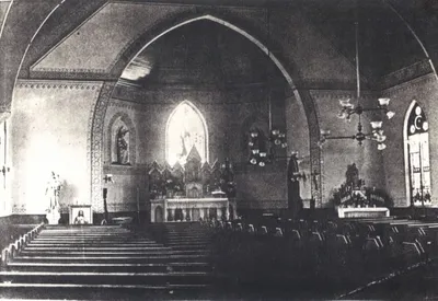 Interior, late 1800s. The present-day stained glass window is visible. Source: Parish Web site