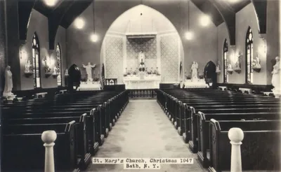 Interior, Christmas 1947. The stained glass window has been covered. Source: Parish Web site