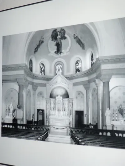 Photograph of interior with intact altar rail.