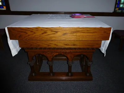 Altar with base made from former altar rail.
