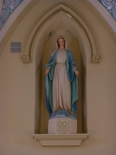 Statue of Our Lady above high altar.