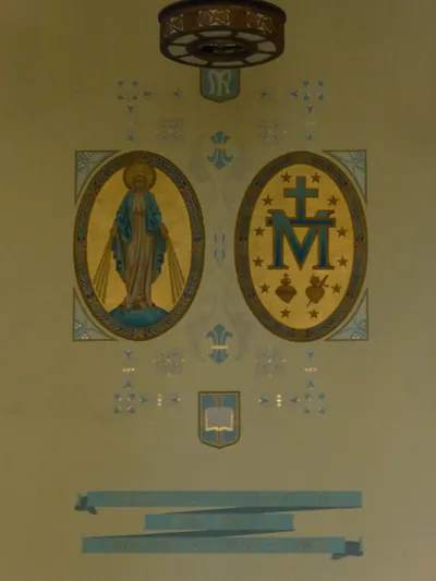 Our Lady paintings on wall.