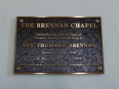 Plaque outside chapel.