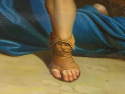 The artist hid his face in three of the stations. Here it's in the shoe.