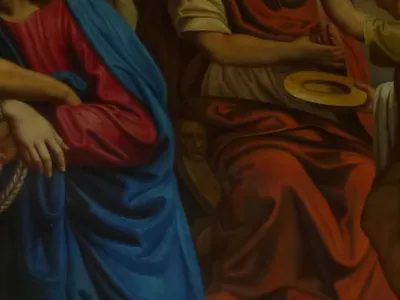 The artist hid his face in three of the stations. Here it's on Pilate's chair.