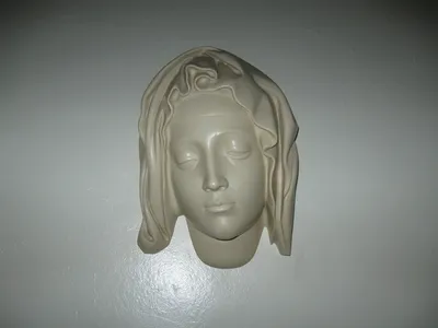 Small sculpture of Our Lady's face.
