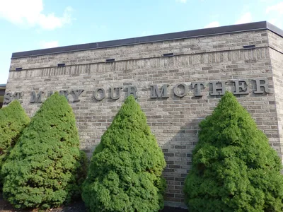 Sign on church building.