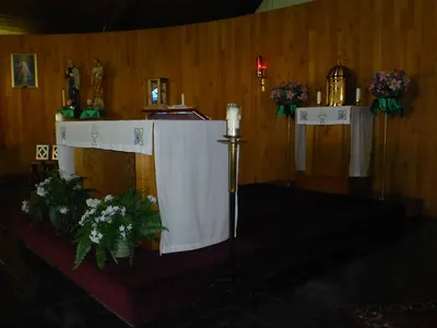 Altar and tabernacle seen from angle.
