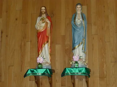 Sacred Heart and Our Lady statues.