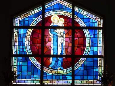 Stained glass behind altar.