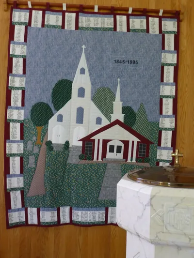 Tapestry of present and former church.