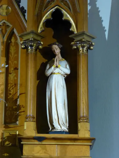 Statue in reredo.