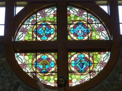 Stained glass above sanctuary.