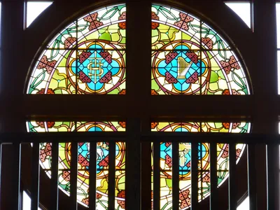 Stained glass above narthex.