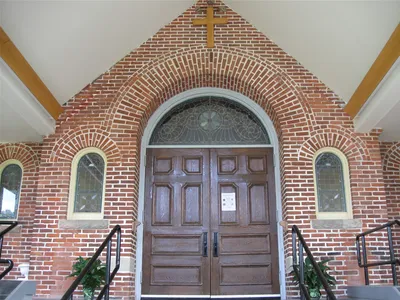 Doors inside narthex, former main doors.