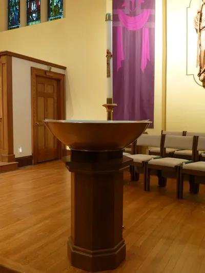 Baptismal font and paschal candle.