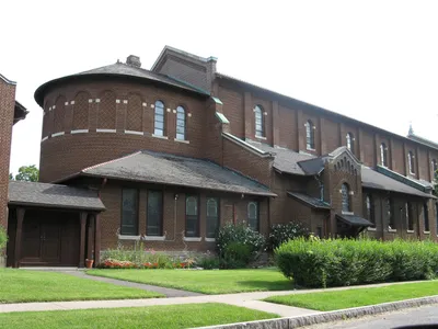 Left side of the church.