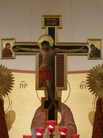 Crucifix above altar.