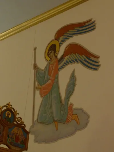 Angel icon on wall.