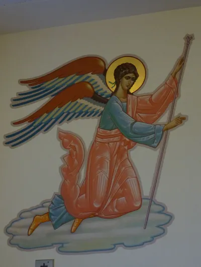 Angel icon on wall.
