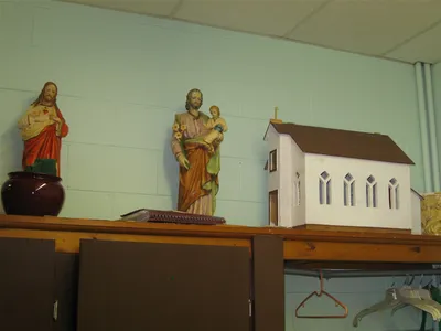 Small statues and model of former church.