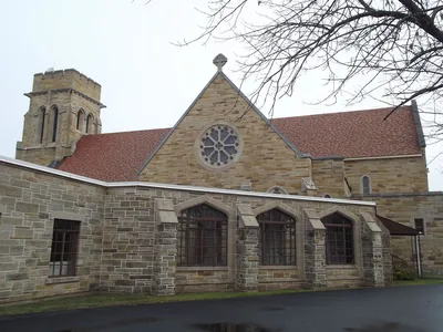 Back right corner with walkway leading from rectory to church.
