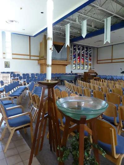 Paschal candle and baptismal font.