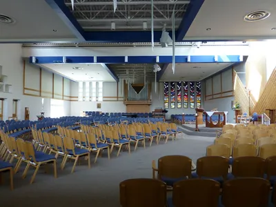 Left side of the church.