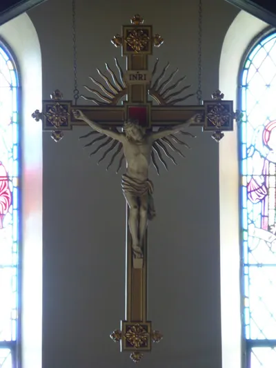 Crucifix above choir loft.