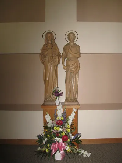 Holy Family statues behind altar, July 2011. Prior to large crucifix installation.