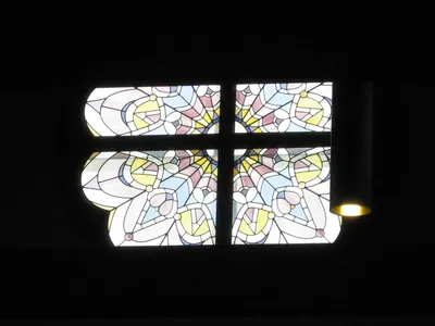 Stained glass above sanctuary.