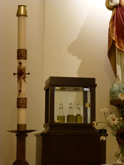 Ambry and paschal candle.